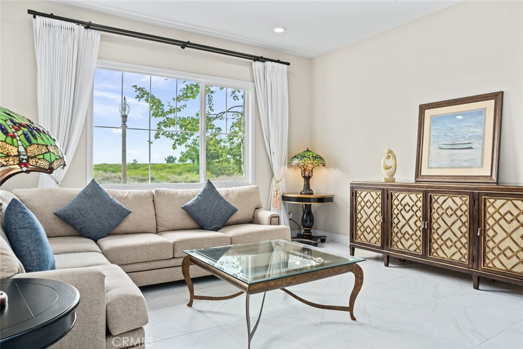 168 Perspective Irvine, CA 92618 - Photo 4 of 49 a living room with furniture and a large window