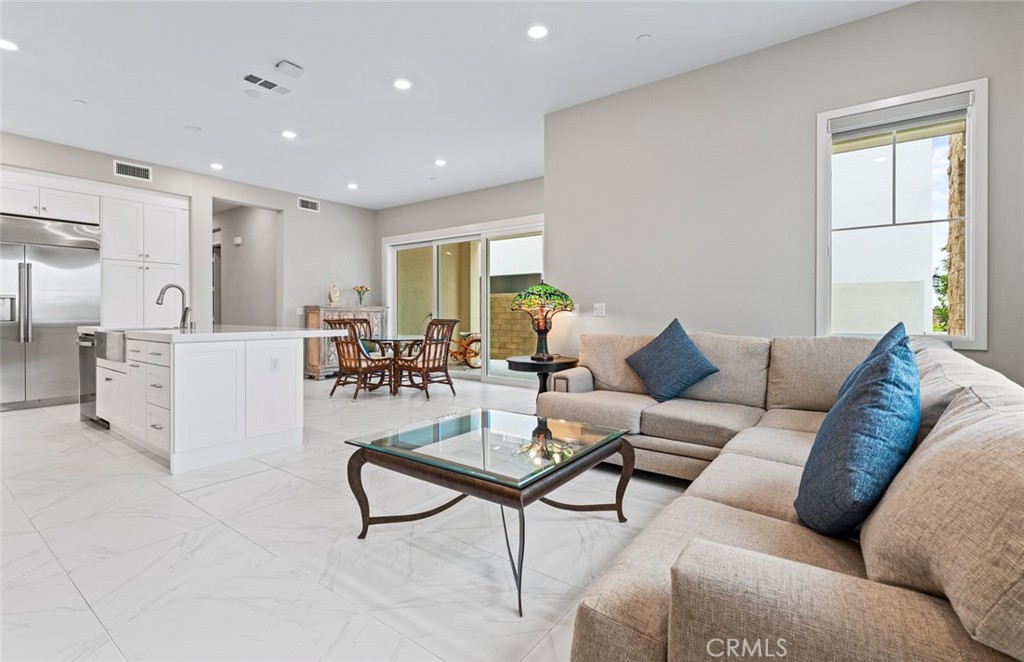 168 Perspective Irvine, CA 92618 - Photo 7 of 49 a living room with furniture and a large window