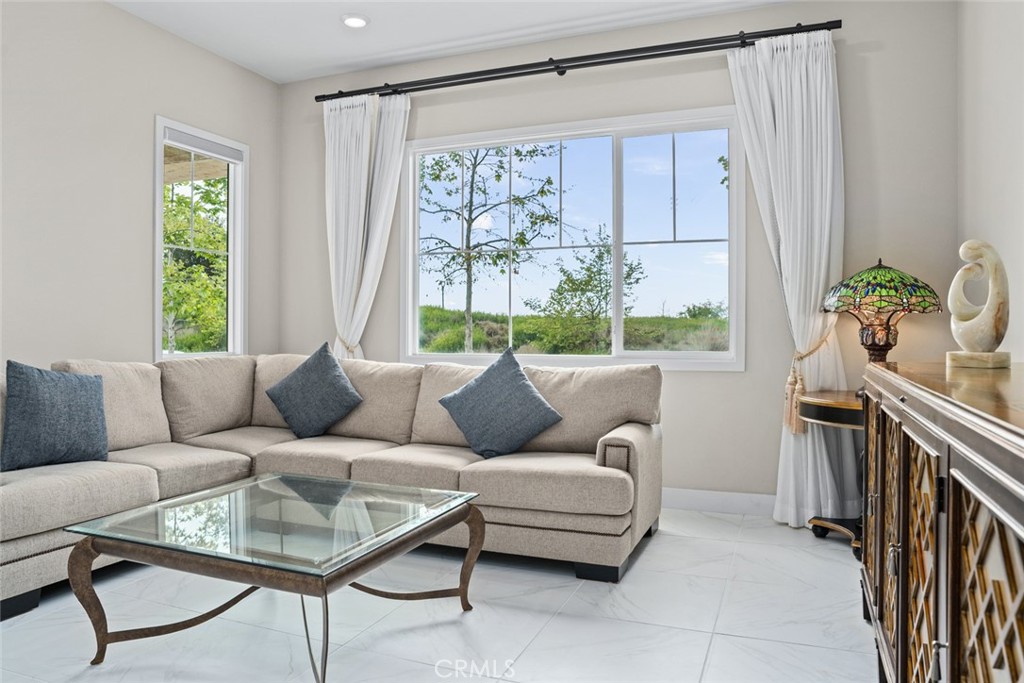 168 Perspective Irvine, CA 92618 - Photo 8 of 49 a living room with furniture and a large window