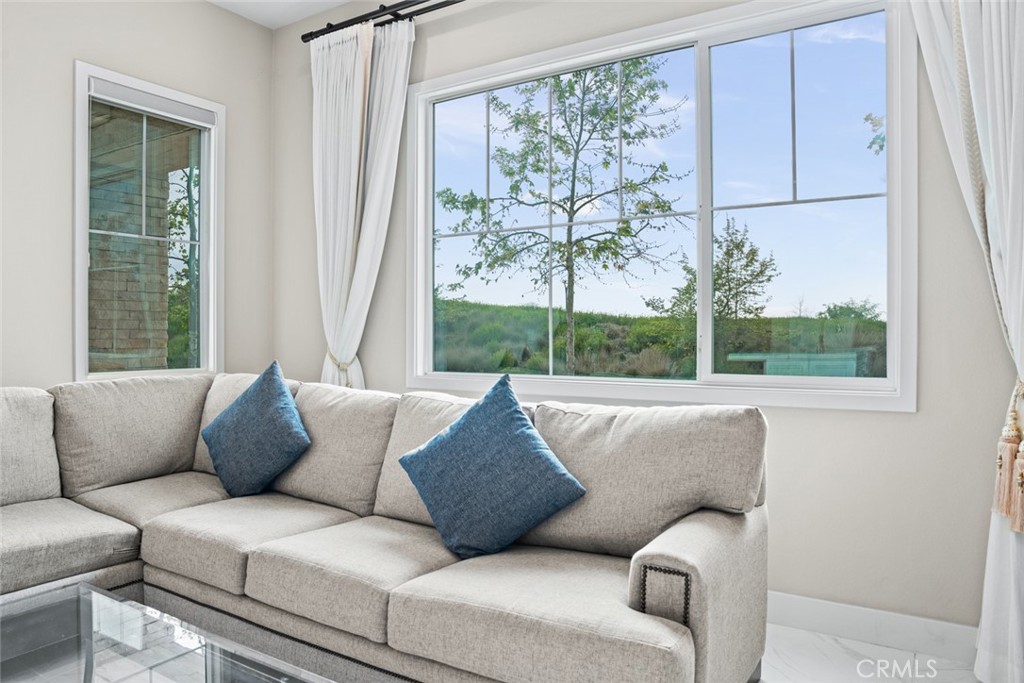 168 Perspective Irvine, CA 92618 - Photo 10 of 49 a living room with furniture and a large window