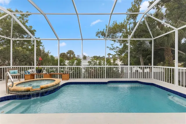 a roof deck with couch and chairs