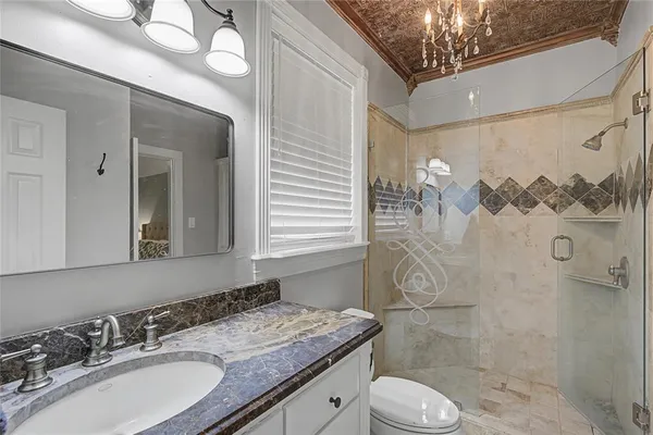 a bedroom with furniture and a window