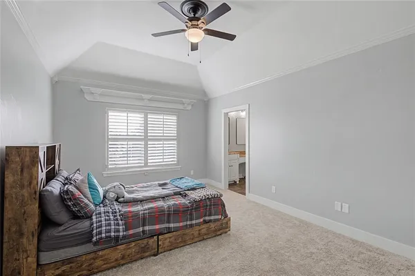 a living room with a couch and a stove top oven