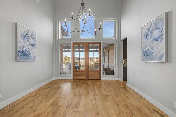 a dining room with furniture a fireplace and wooden floor