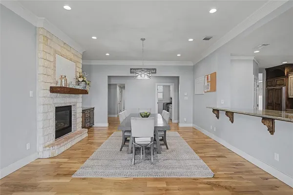 a kitchen with stainless steel appliances granite countertop a sink and refrigerator