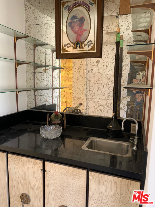 2425 Crest View Drive Los Angeles, CA 90046 - Photo 1 of 14 a bathroom with a sink and a mirror
