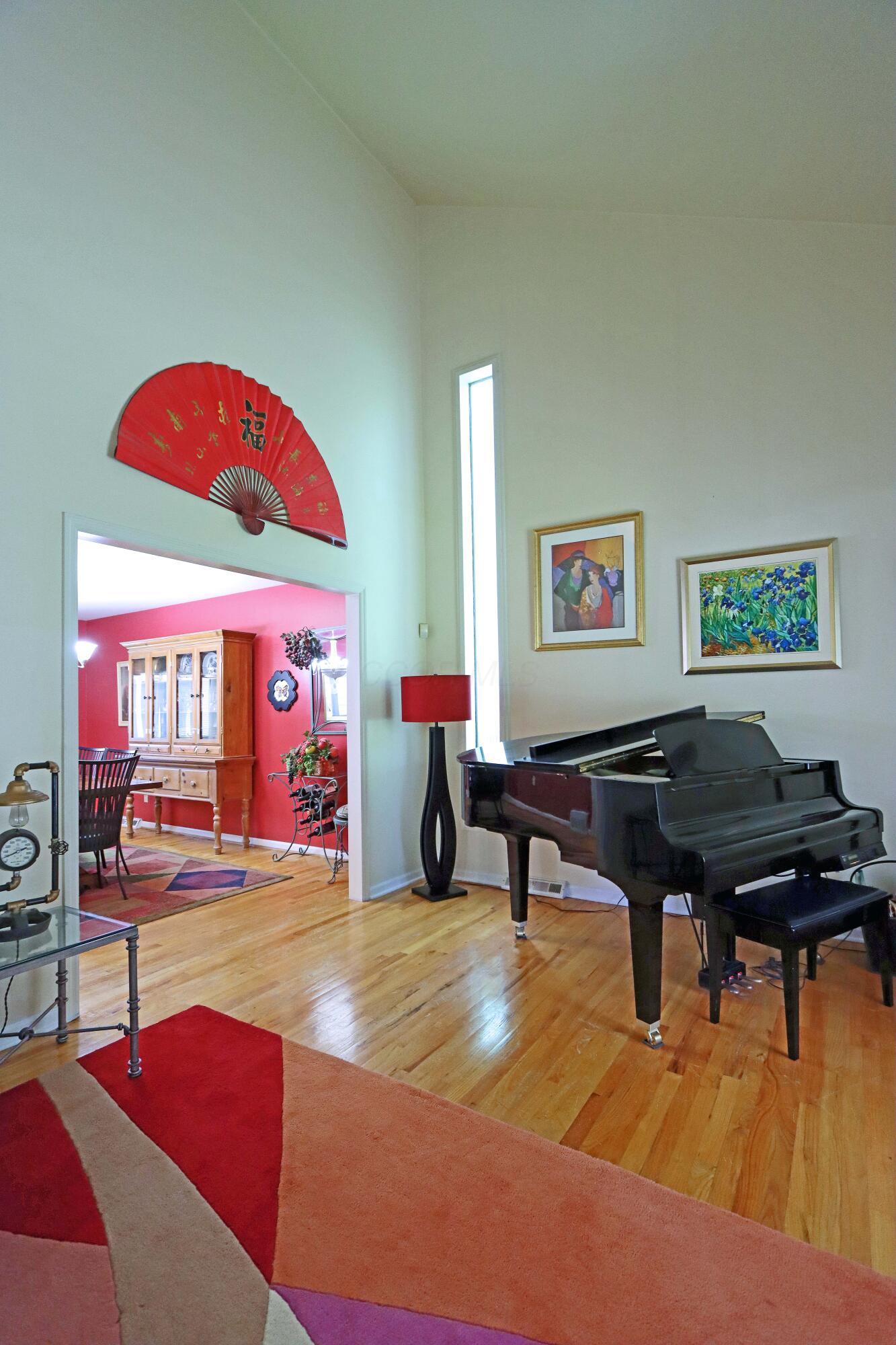3969 Newhall Road Upper Arlington, OH 43220 - Photo 11 of 82 great room with hardwood flooring and ample space for a baby gram piano