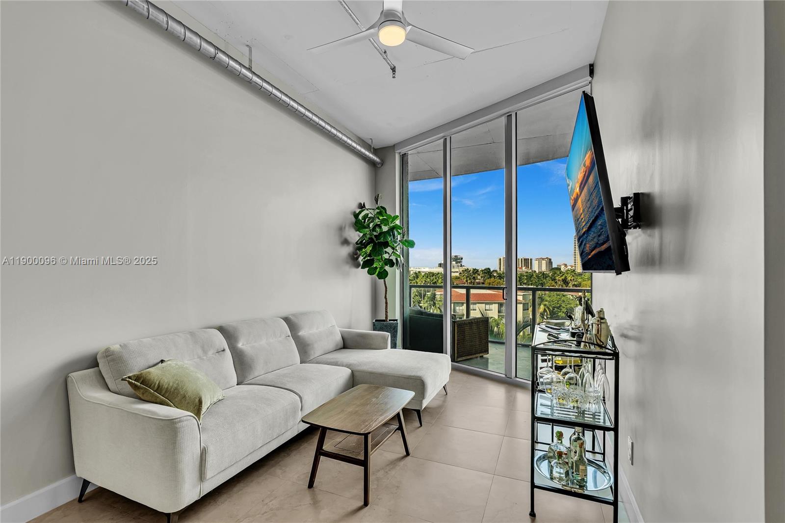 3029 Northeast 188th Street, Unit 503 Aventura, FL 33180 - Photo 14 of 60 a living room with furniture and a potted plant