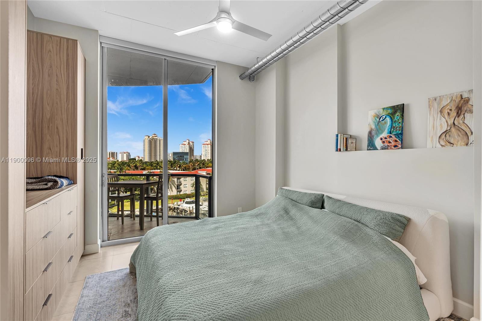 3029 Northeast 188th Street, Unit 503 Aventura, FL 33180 - Photo 28 of 60 a bedroom with a bed and a cabinets