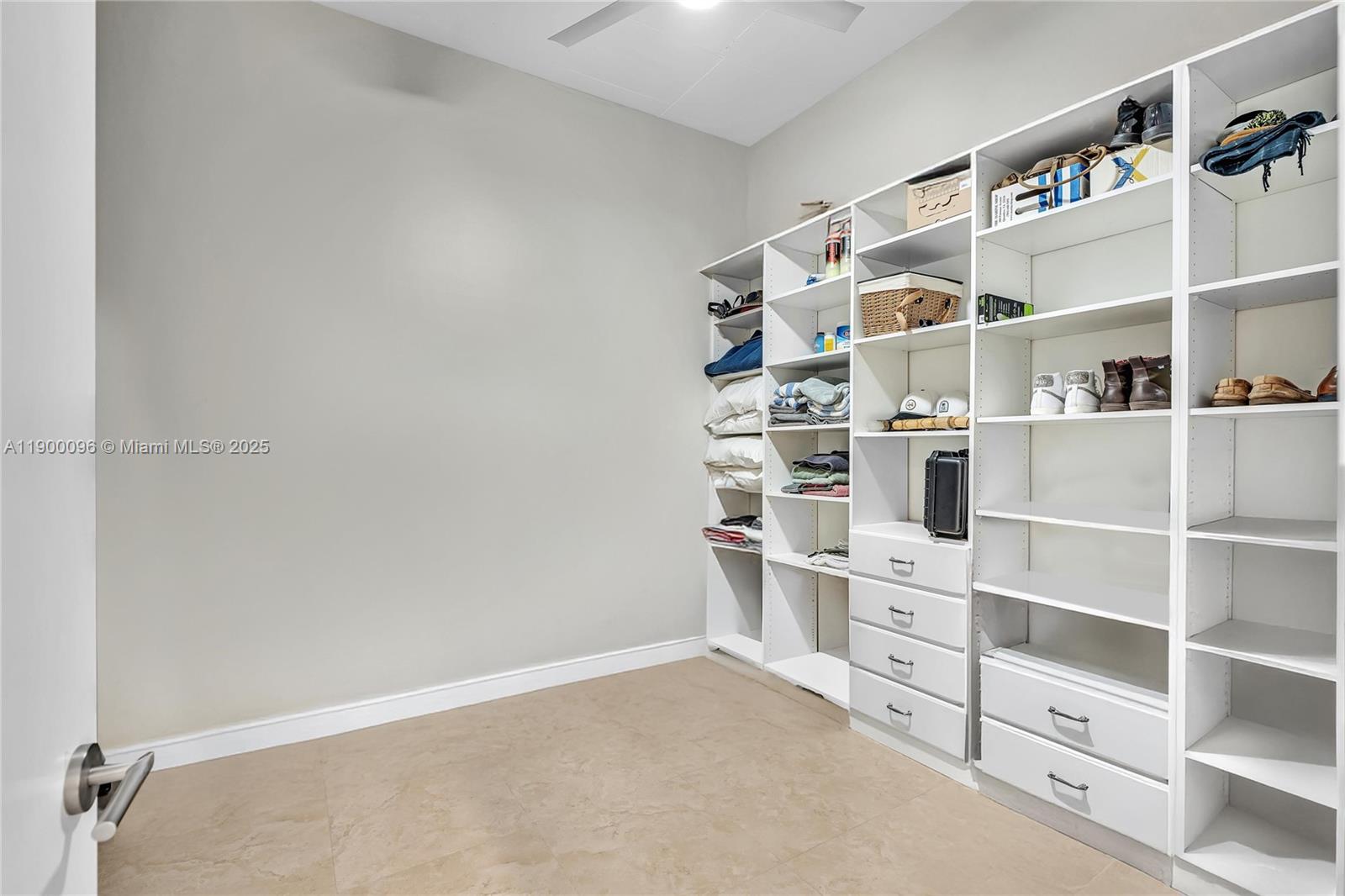3029 Northeast 188th Street, Unit 503 Aventura, FL 33180 - Photo 35 of 60 a view of walk in closet with empty racks