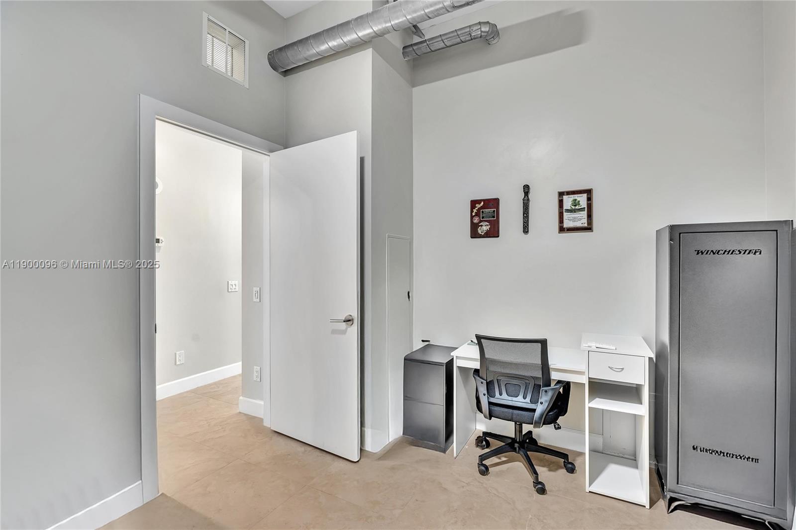 3029 Northeast 188th Street, Unit 503 Aventura, FL 33180 - Photo 36 of 60 a view of a workspace with furniture and a window