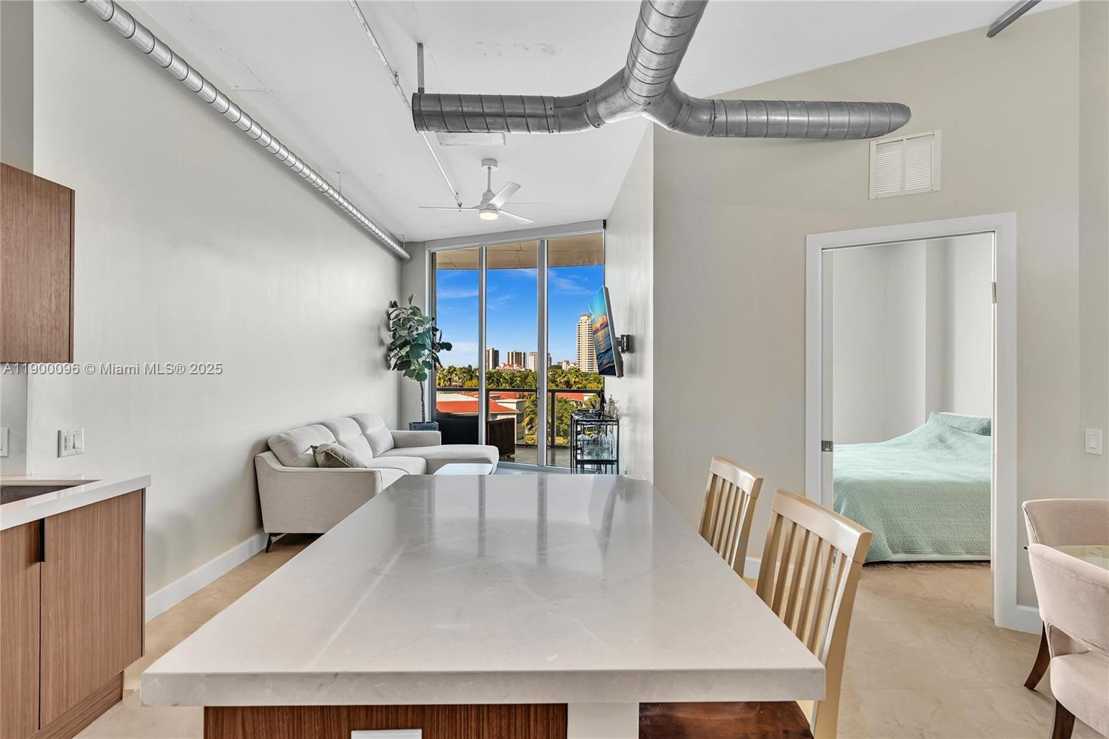 3029 Northeast 188th Street, Unit 503 Aventura, FL 33180 - Photo 5 of 60 a living room with furniture and a table