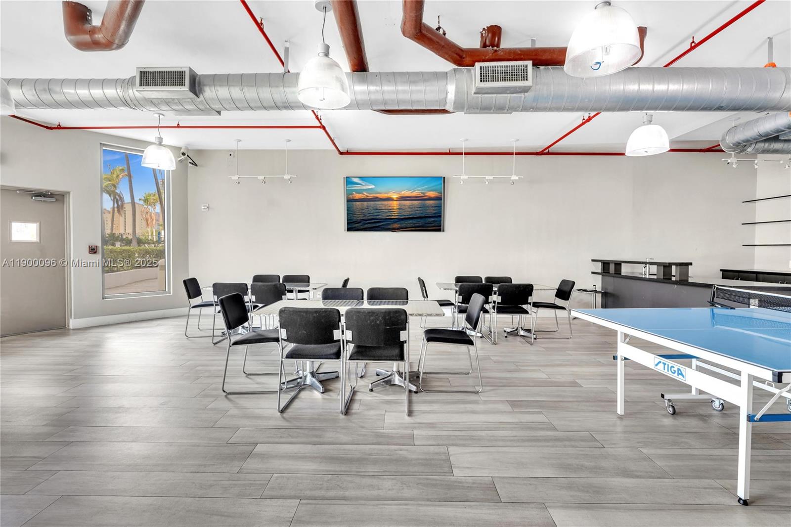 3029 Northeast 188th Street, Unit 503 Aventura, FL 33180 - Photo 53 of 60 a living room with furniture and a flat screen tv