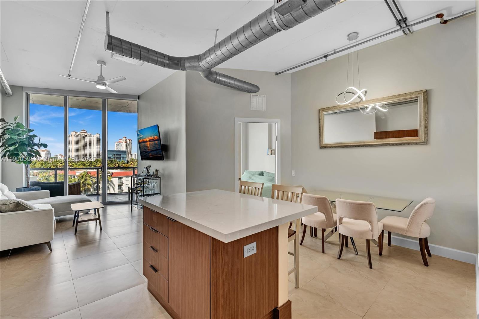 3029 Northeast 188th Street, Unit 503 Aventura, FL 33180 - Photo 8 of 60 a view of a dining room with furniture
