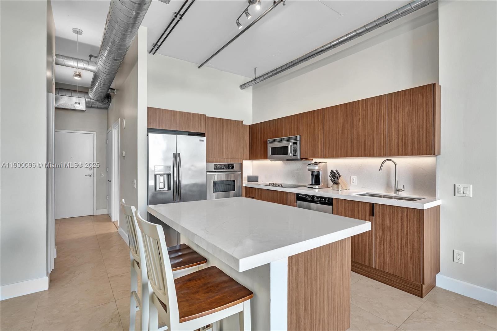 3029 Northeast 188th Street, Unit 503 Aventura, FL 33180 - Photo 9 of 60 a kitchen that has a cabinets and a stove