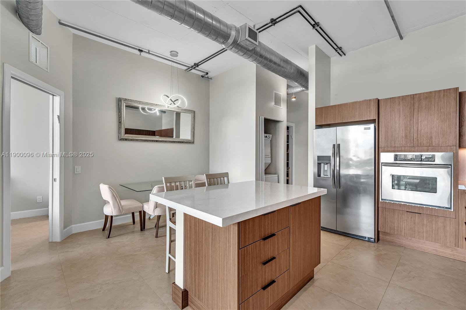 3029 Northeast 188th Street, Unit 503 Aventura, FL 33180 - Photo 10 of 60 a kitchen with a stove a refrigerator and a refrigerator