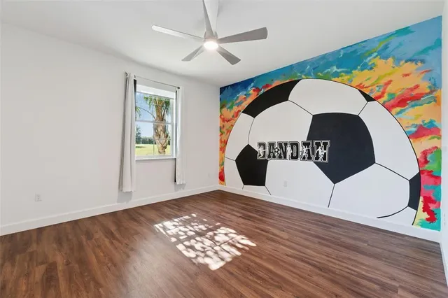 a view of a swimming pool with a patio and plants