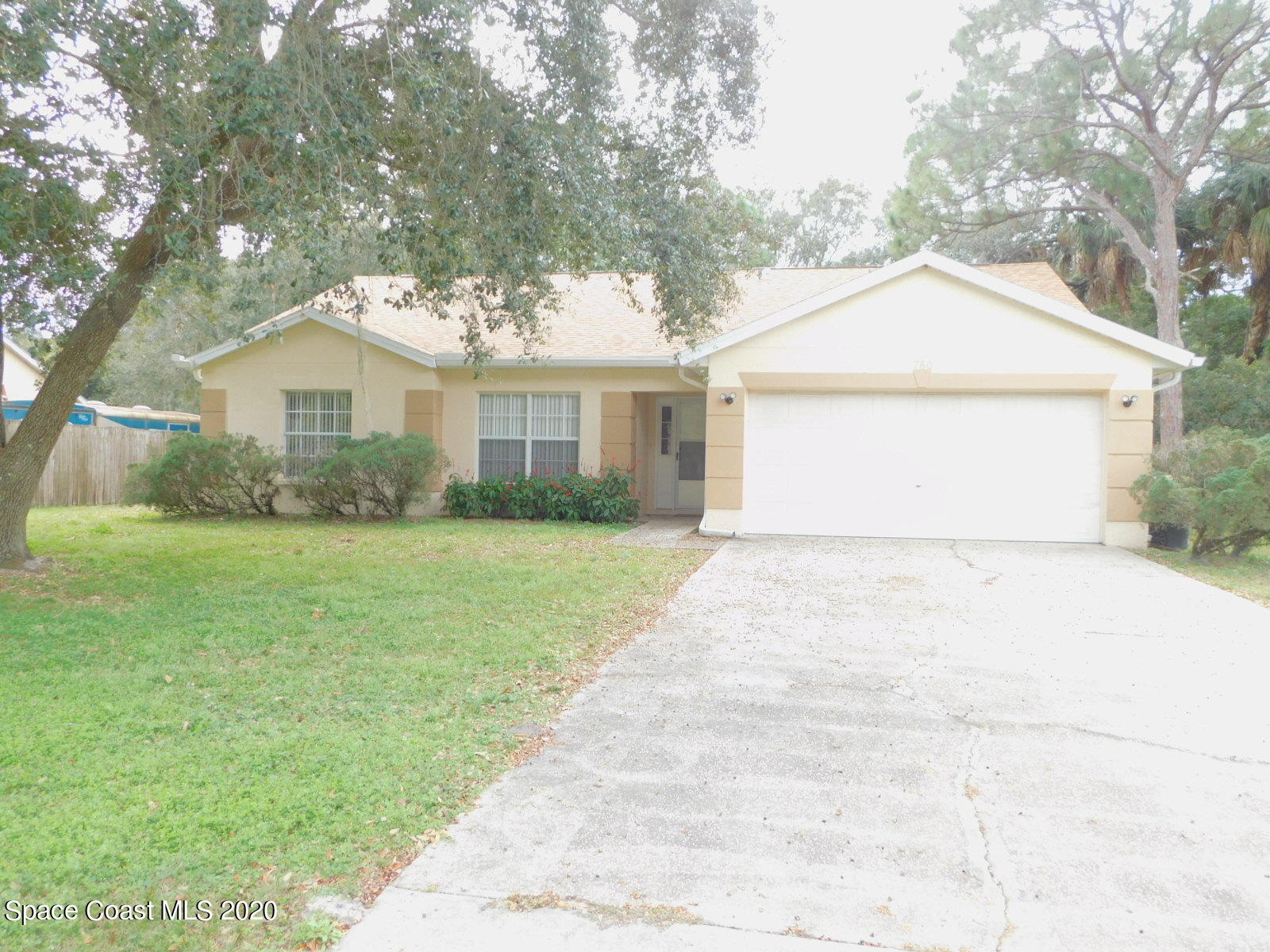 760 Riviera Drive Northeast Palm Bay, FL 32905 - Photo 1 of 8 a view of outdoor space yard and front view of a house