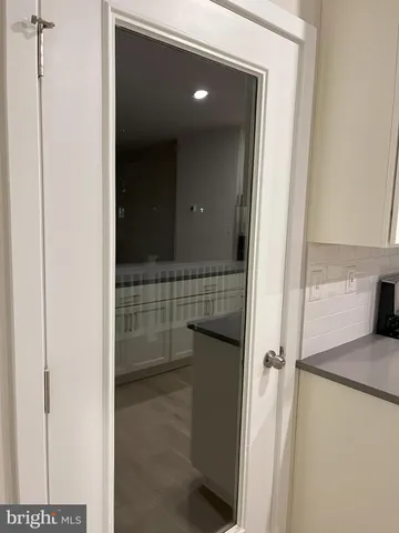 a bathroom with a shower and a sink