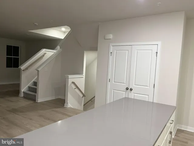 a view of a livingroom with stairs