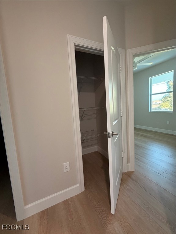 101 Pennfield Street Lehigh Acres, FL 33974 - Photo 18 of 29 an empty room with wooden floor and entrance