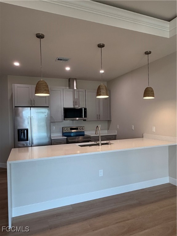 101 Pennfield Street Lehigh Acres, FL 33974 - Photo 4 of 29 a large kitchen with stainless steel appliances a large counter top a sink and a stove
