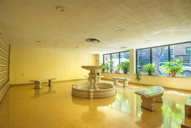 a view of a swimming pool and table or chairs