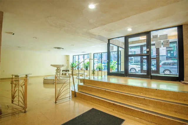 a spacious bathroom with a large window and a bath tub