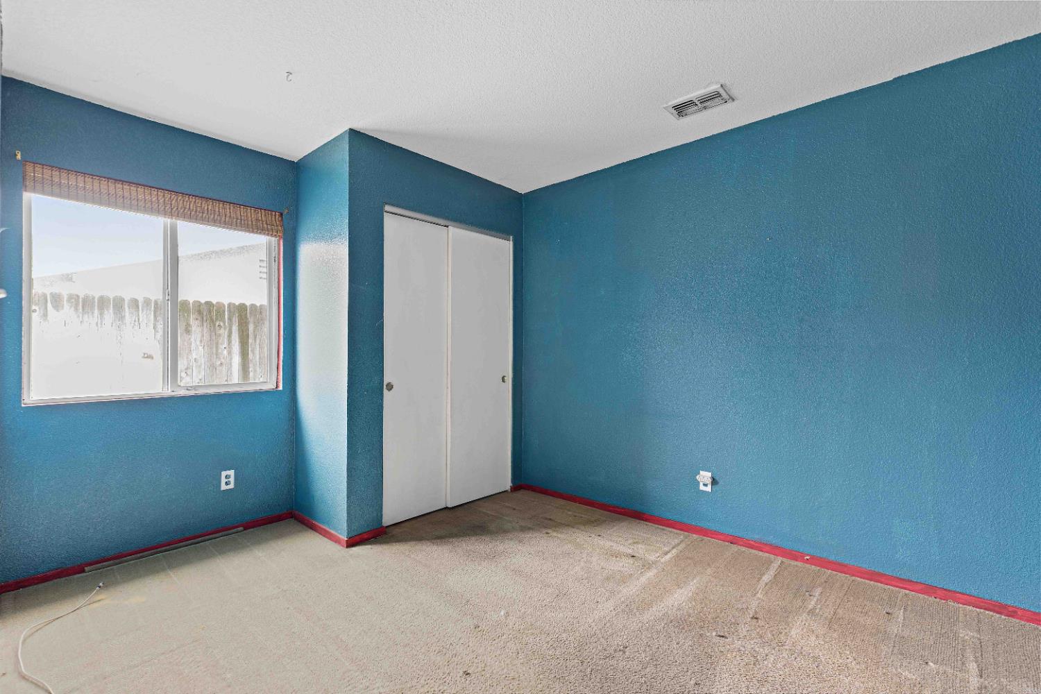 310 West F Street Turlock, CA 95380 - Photo 16 of 27 an empty room with windows