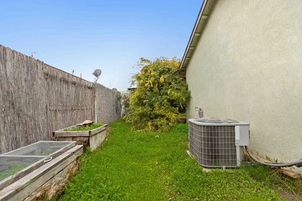 a view of a pathway both side of the house