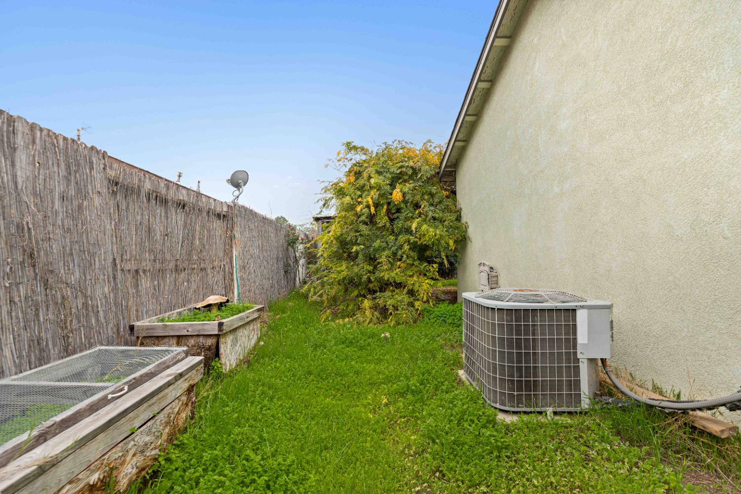 310 West F Street Turlock, CA 95380 - Photo 17 of 27 a backyard of a house with garden and plants