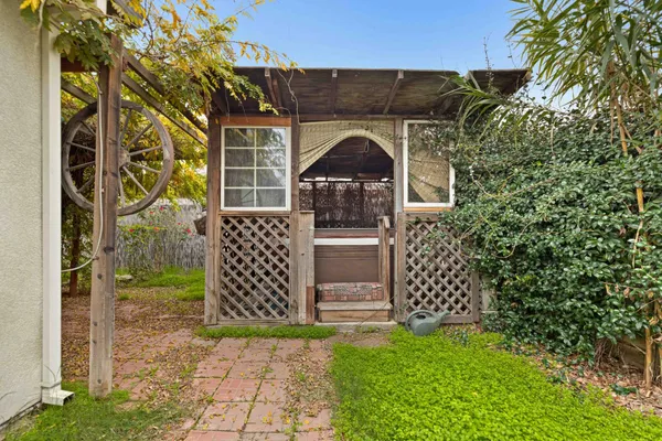 a view of a backyard with pathway