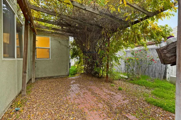 a view of a pathway of a wooden fence