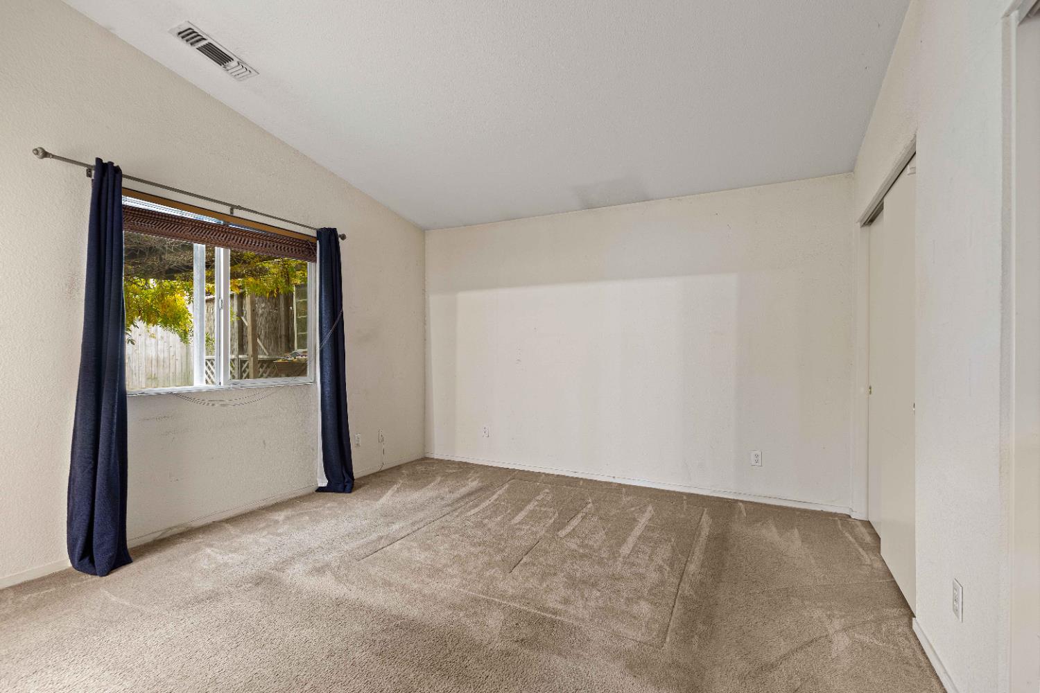 310 West F Street Turlock, CA 95380 - Photo 10 of 27 a view of an empty room with a window