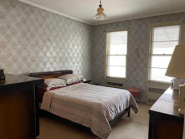 4021 Avenue R Brooklyn, NY 11234 - Photo 14 of 20 a bedroom with a bed two lamps and a window
