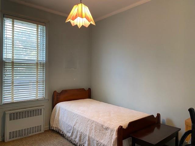 4021 Avenue R Brooklyn, NY 11234 - Photo 8 of 20 a bedroom with a bed and a chair