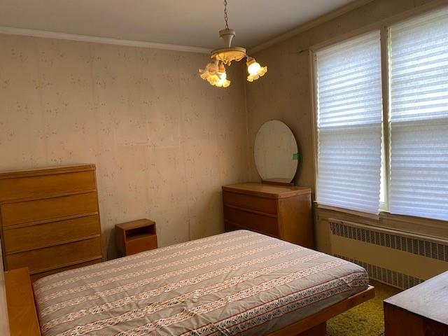 4021 Avenue R Brooklyn, NY 11234 - Photo 10 of 20 a bedroom with a bed and a dresser