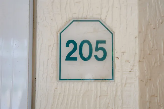 a close up of a sign on a wall