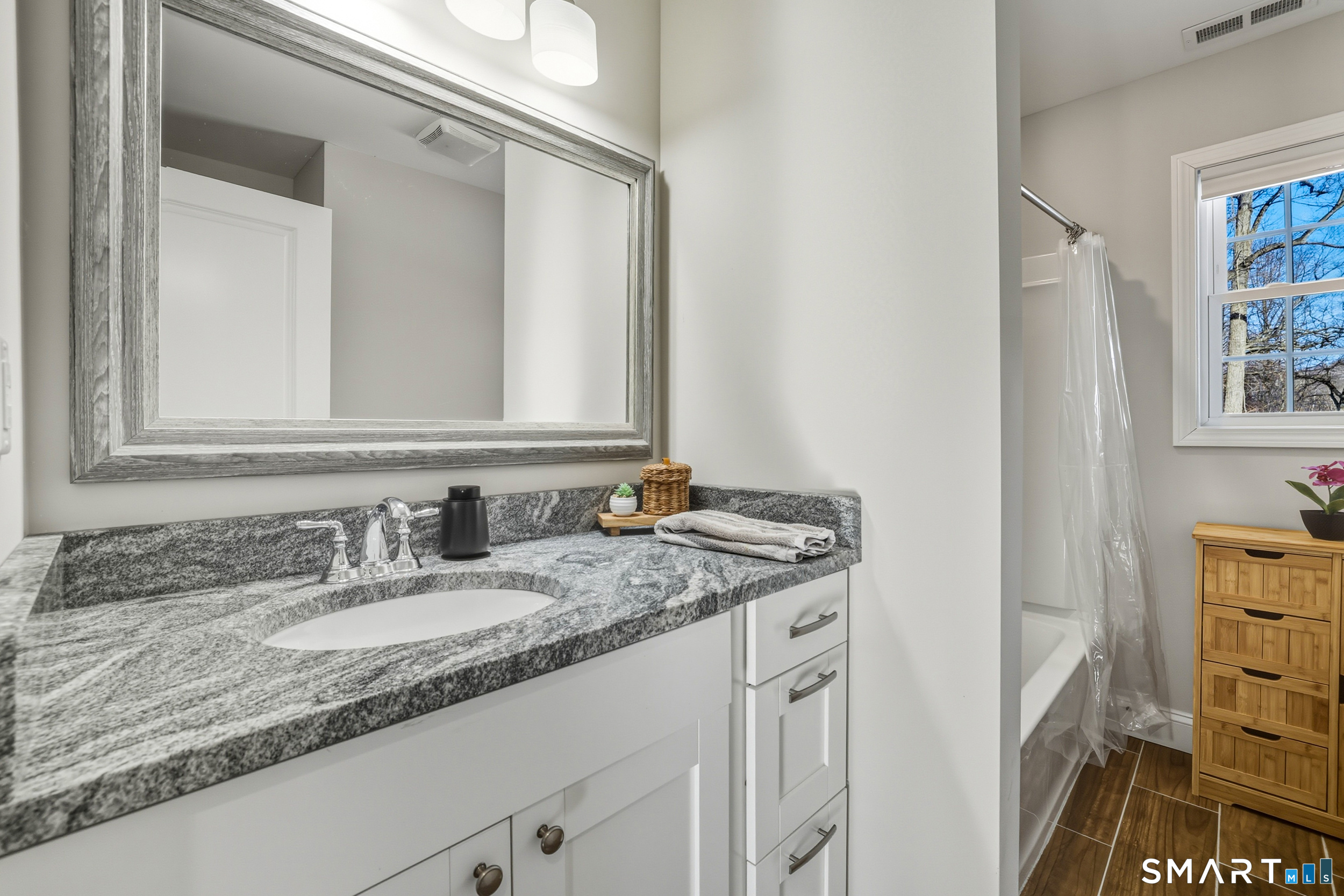 8 Egypt Lane Clinton, CT 06413 - Photo 15 of 33 A second full bath with tile flooring and combination tub/shower.