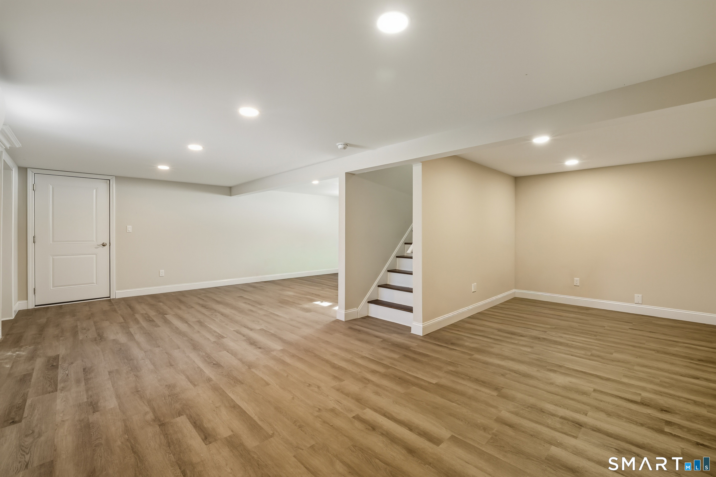 8 Egypt Lane Clinton, CT 06413 - Photo 17 of 33 The finished lower level walk-out offers an additional 500 SF of heated living space.