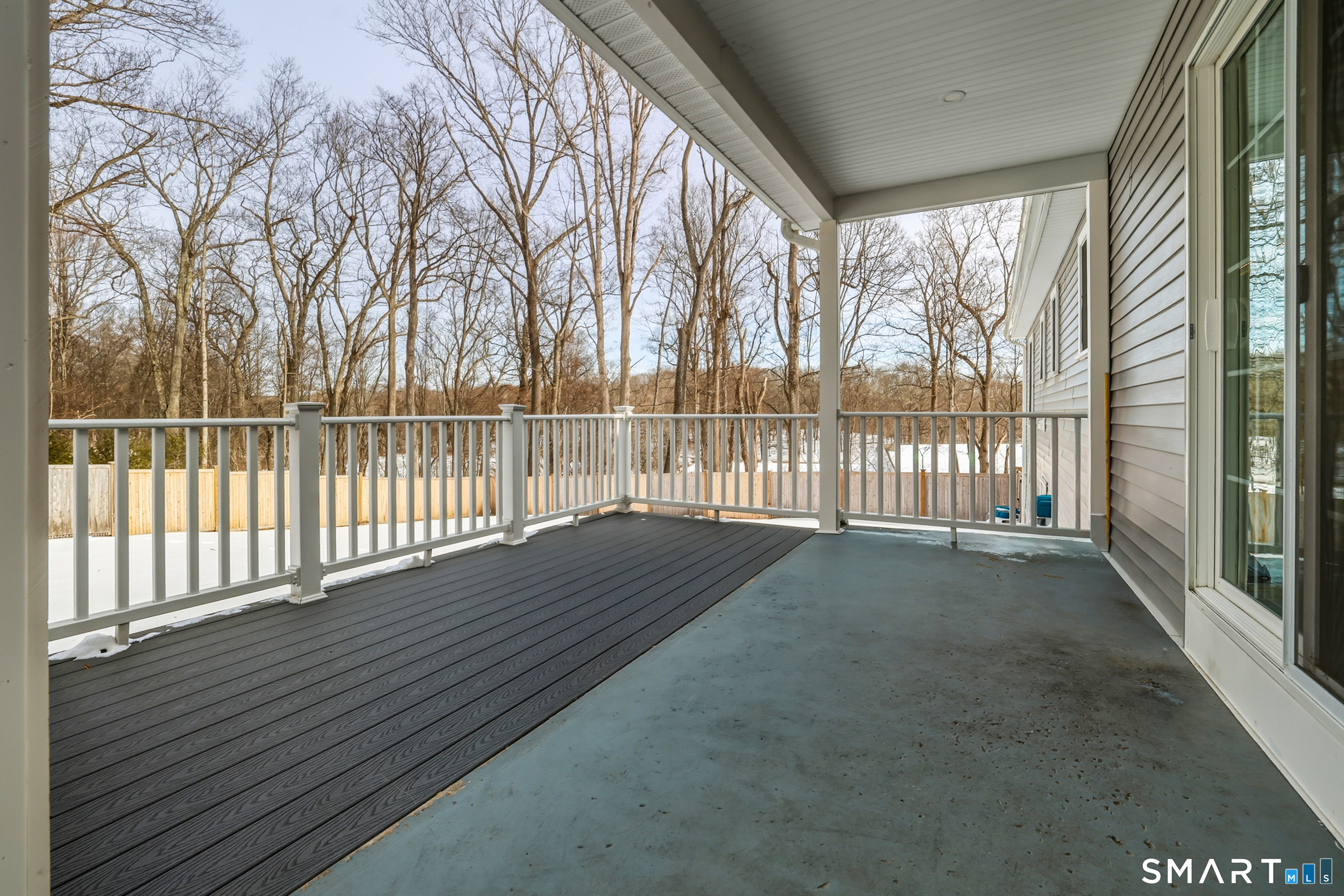 8 Egypt Lane Clinton, CT 06413 - Photo 20 of 33 Partially covered TREX deck overlooking a private, fully fenced in backyard.