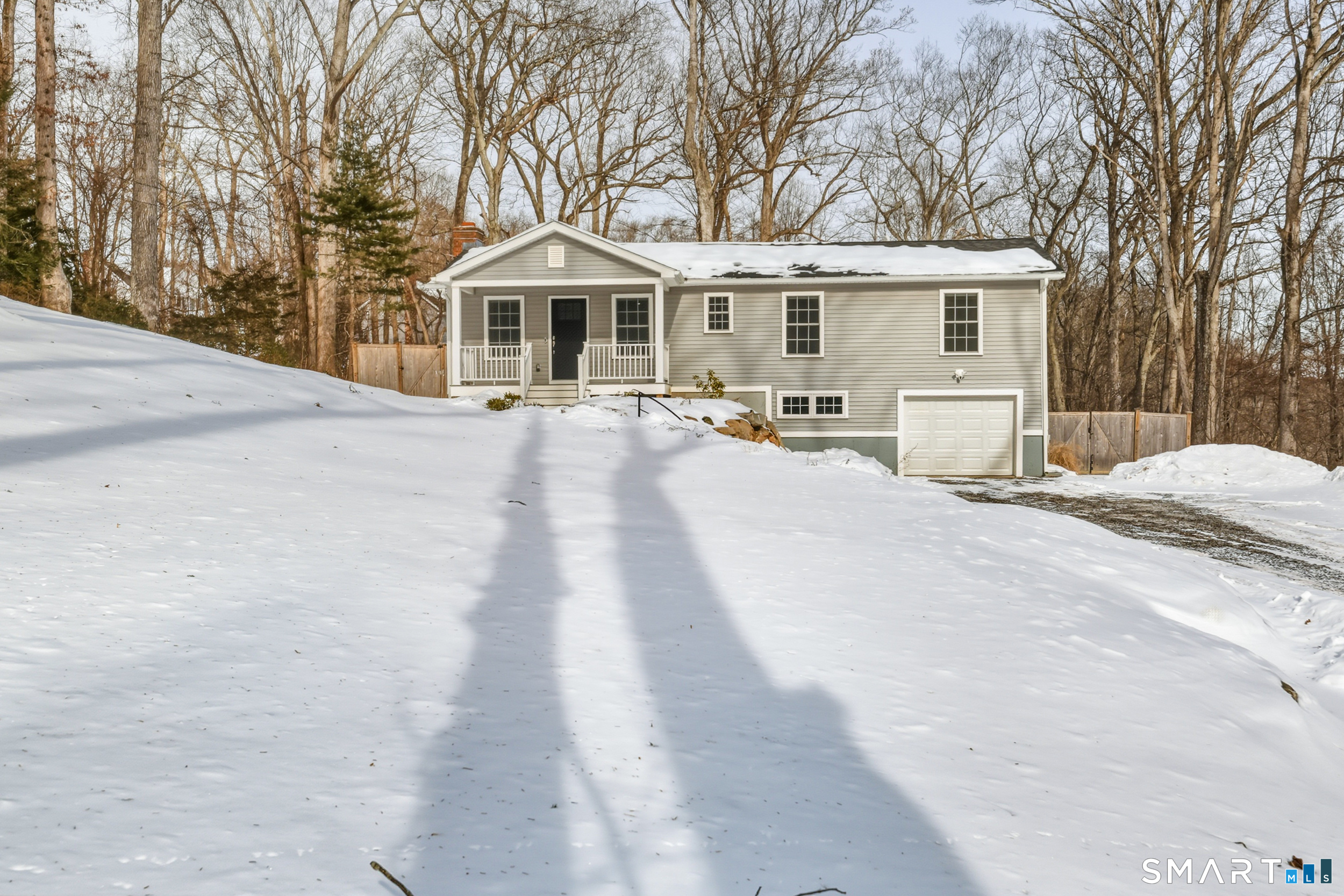 8 Egypt Lane Clinton, CT 06413 - Photo 23 of 33 Gravel driveway to the one-car garage with electric door opener.