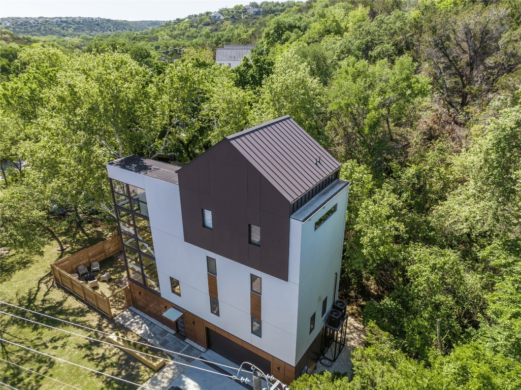 View from above of property with a heavily wooded area