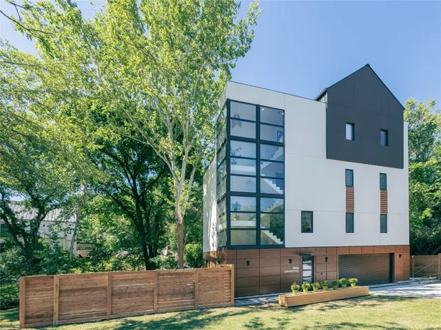 a swimming pool with some tall trees