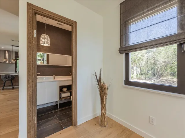 a hallway with a washer and dryer