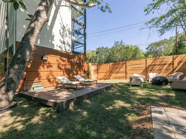 a view of a backyard with sitting area
