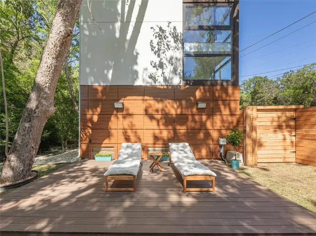 a swimming pool with outdoor seating and yard