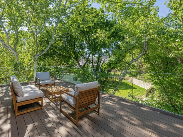 a view of a backyard with sitting area