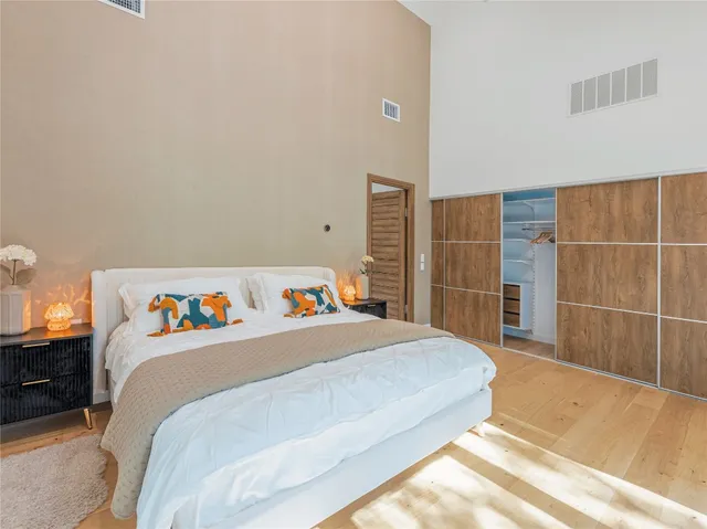 a bedroom with a bed and a cabinets