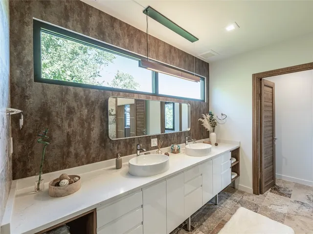 a bathroom with a double vanity sink mirror and double